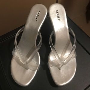 Silver heels w/ clear bottoms. Good condition.